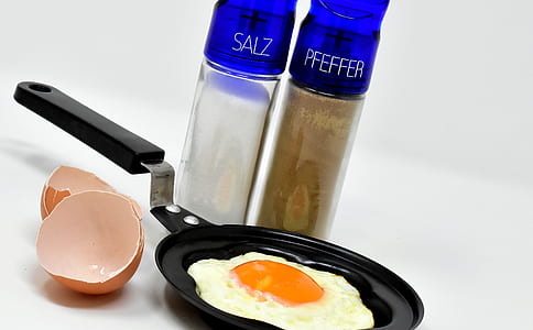 sunny side-up egg on black frying pan thumbnail