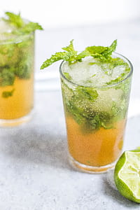 cocktail with slice of lemon and celery thumbnail