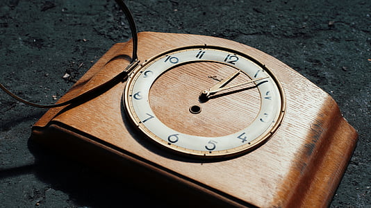 close-up photography of brown wooden framed analog clock at 12:06 thumbnail