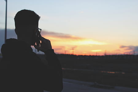 silhouette photo of man calling thumbnail