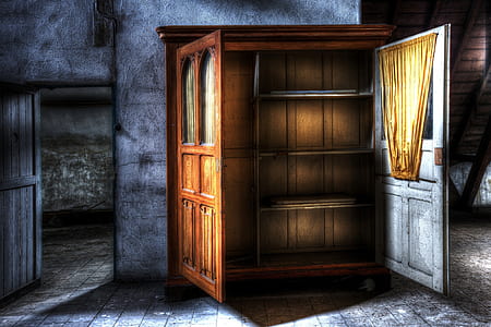 photograph of opened cabinet between doorway thumbnail