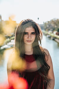 body of water behind woman thumbnail