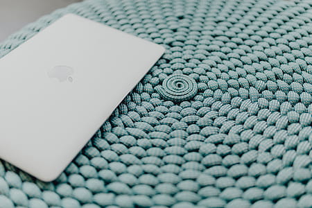 MacBook Laptop on a blue pouf thumbnail