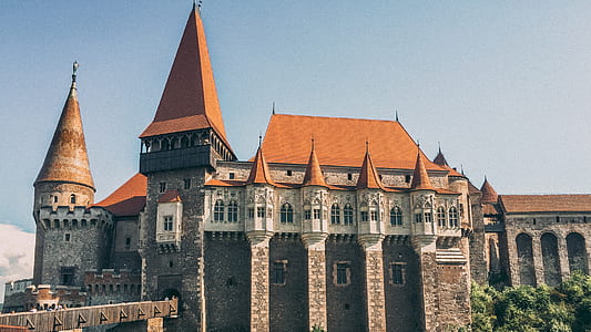 brown concrete castle with orange roof thumbnail