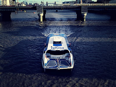 Photography of White And Blue Boat thumbnail