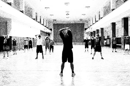 greyscale photography of people doing stretches thumbnail