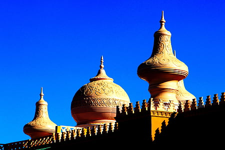 worms eye view photography of mosque under blue sky thumbnail