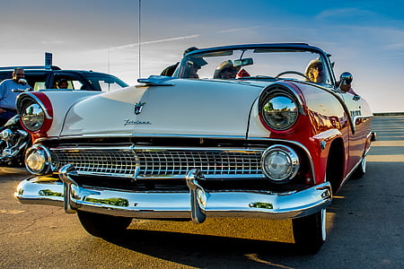 silver and red convertible on road thumbnail