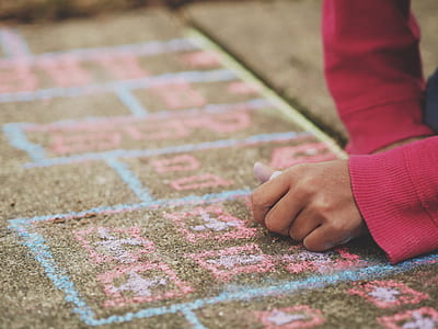 person writing on brown concrete pavement thumbnail
