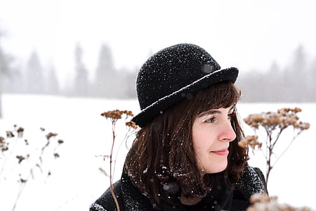 woman looking at left side surrounded by flowers thumbnail
