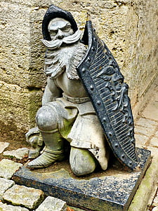 man holding black shield statuette thumbnail