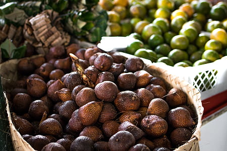 Pile of Brown Fruit With Brown Basket thumbnail