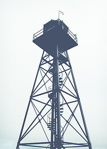 black watch tower under cloudy sky thumbnail
