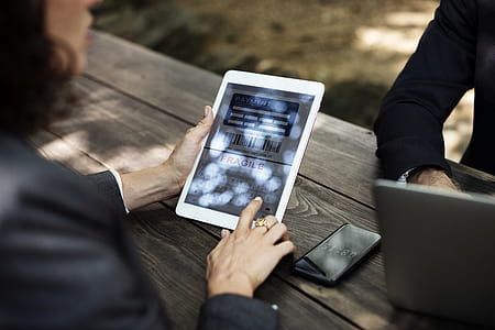 woman holding tablet computer thumbnail