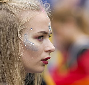 woman wearing red lipstick with rhinestone on her face thumbnail