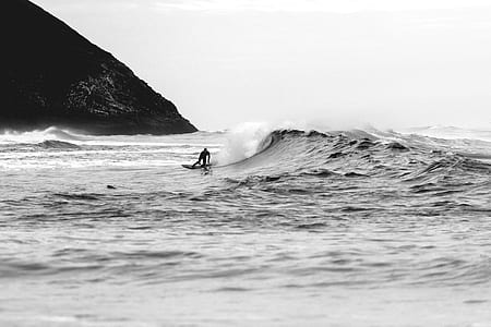 grayscale photography of person surfing thumbnail