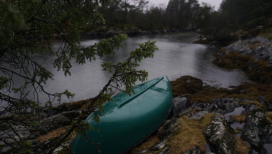 green kayak near body of water thumbnail