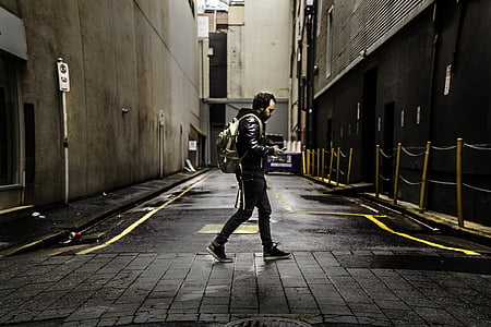 person in black jacket walking thumbnail
