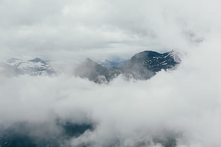 mountain alps covered with clouds thumbnail