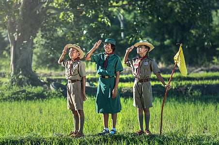 boy and girl standing beside rice fields during daytime thumbnail