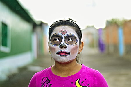 woman wearing makeup mask and purple crew-neck top thumbnail