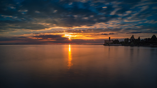 calm body of water during sunset thumbnail