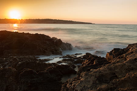 Scenic View of Sea Against Dramatic Sky during Sunset thumbnail