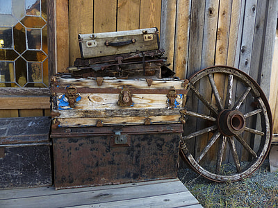 photo of brown wooden chest boxes on top of rusty black metal chest box thumbnail