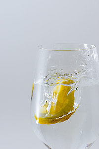 clear drinking glass filled with clear liquid thumbnail