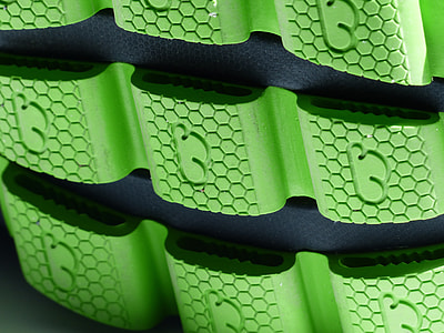 green and black rubber thumbnail