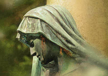 selective focus photography of female statue wearing head cover thumbnail