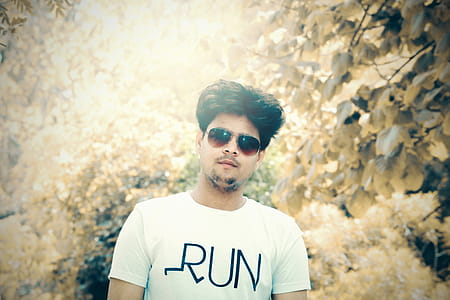 Man in White Crew-neck T-shirt With Sunglasses thumbnail