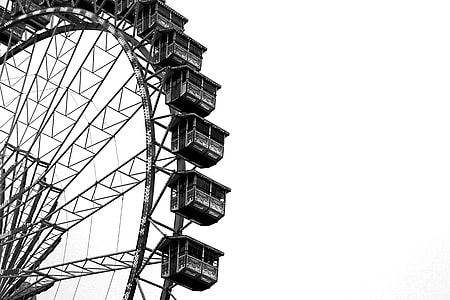 gray ferris wheel under cloudy sky at time thumbnail