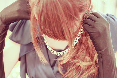 close up photography of woman wearing Diamond necklace thumbnail