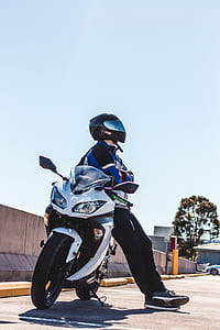 man sitting on sports bike thumbnail