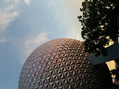 architectural photography of gold and purple ball building thumbnail