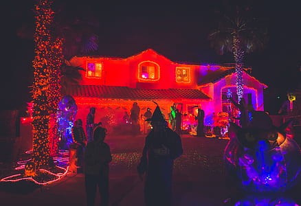 people standing near house during nighttime thumbnail
