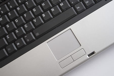 person showing touch pad of laptop computer thumbnail