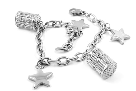 silver-colored charm bracelet on white surface thumbnail