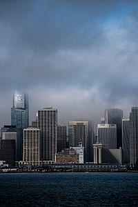 photo of high-rise building near beach at daytime thumbnail