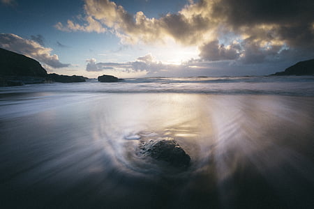 smokey body of water during sunrise thumbnail