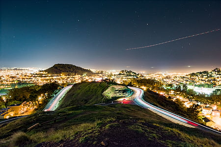 lighted winding road at top of mountain thumbnail