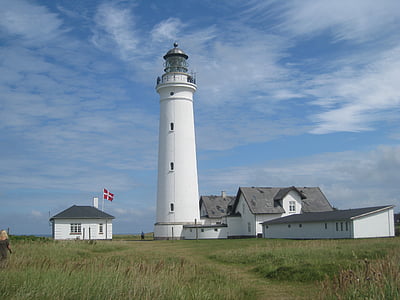 white lighthouse and grass field thumbnail