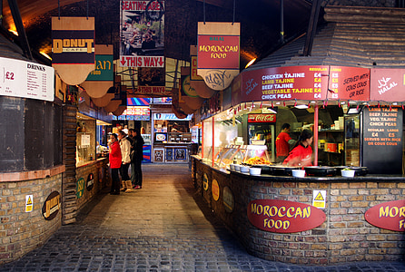 people standing in front of a stall thumbnail