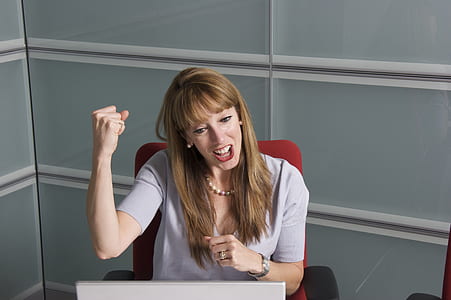 woman wearing gray shirt performing fist up thumbnail
