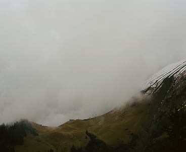 photo of mountain with fogs during daytime thumbnail
