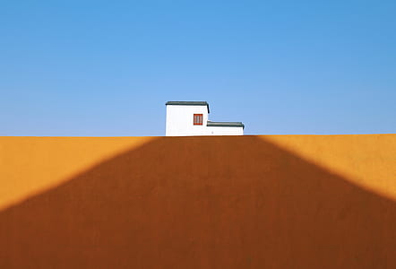 white house over brown soil digital wallpaper thumbnail