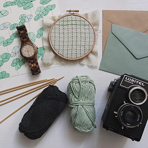 flat lay photography of embroidery accessories thumbnail
