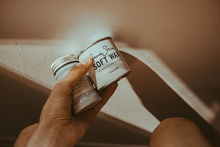 person holding glass container thumbnail