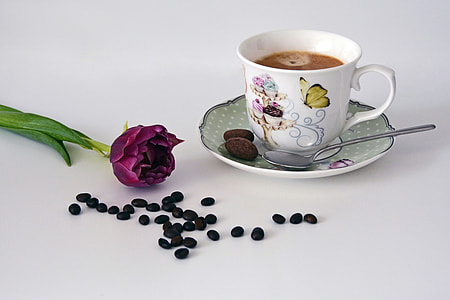 white floral ceramic coffee mug and purple petaled flower thumbnail
